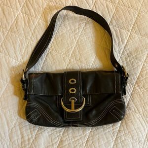 Black coach bag with silver clasp.
